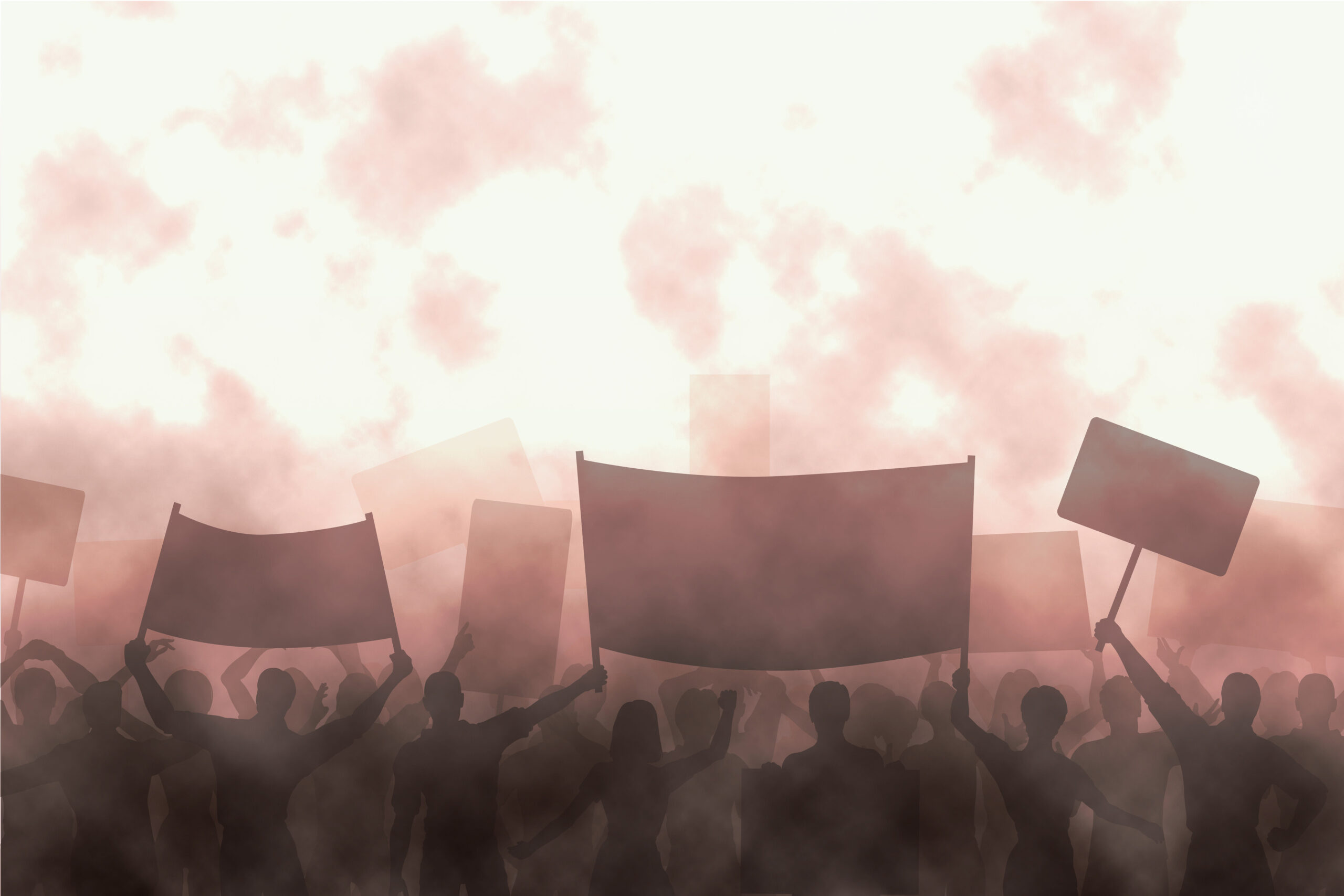 na imagem, há as sombras de diversas pessoas em uma mobilização. Algumas seguram faixas e cartazes